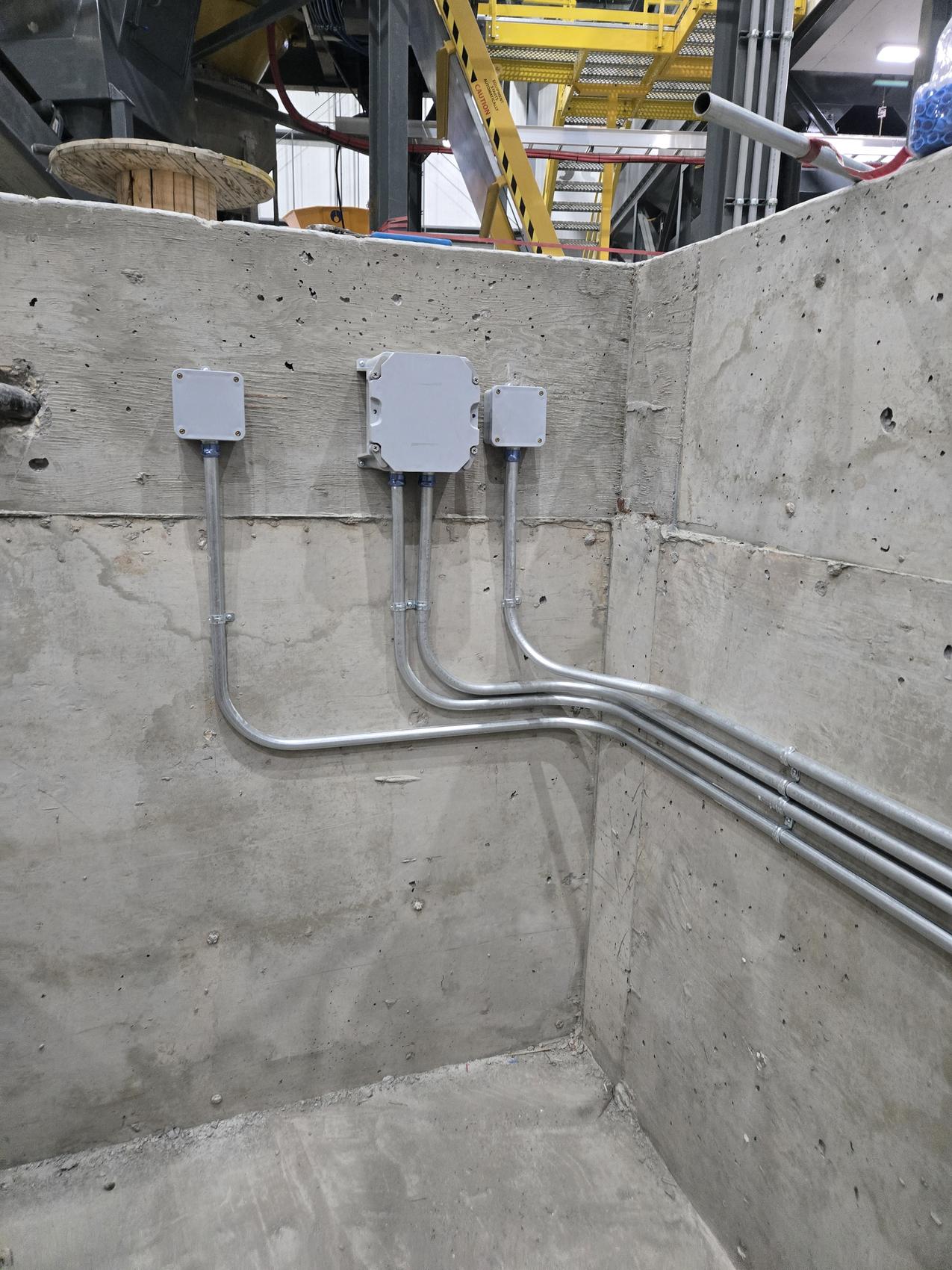 Conduit and junction boxes installed in a plant by Hi-Energy Electrical Services