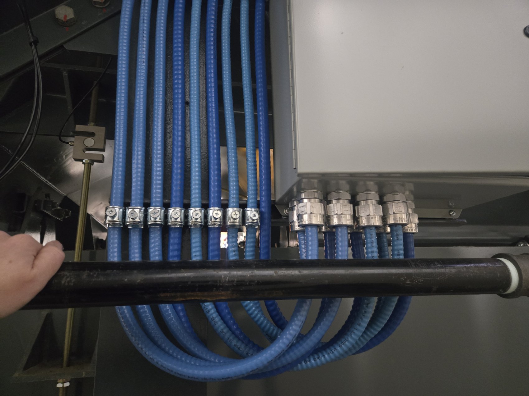 Liquidtight conduit runs into a control enclosure by Hi-Energy Electrical Services