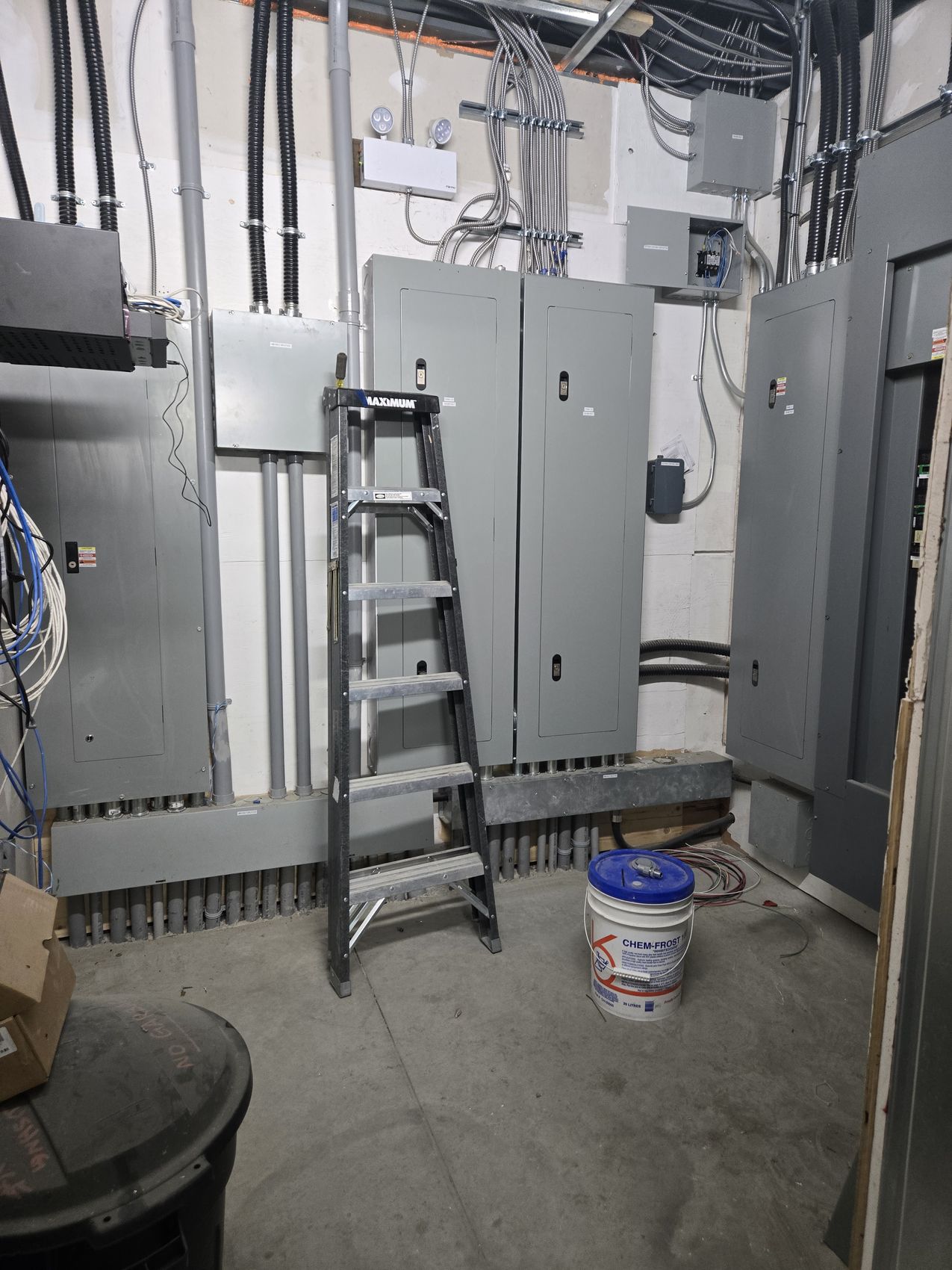 Commercial electrical room with distribution panels installed by Hi-Energy Electrical Services